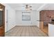 Simple dining area with tile flooring and brick accent wall at 3231 Yorktown St, Sarasota, FL 34231