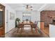 Dining room with brick accent wall and wood table at 3231 Yorktown St, Sarasota, FL 34231