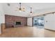 Living room with hardwood floors and brick fireplace at 3231 Yorktown St, Sarasota, FL 34231