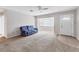 Living room with blue couch and bay window at 3231 Yorktown St, Sarasota, FL 34231