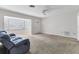 Spacious living room featuring a blue couch and tile floor at 3231 Yorktown St, Sarasota, FL 34231