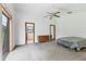 Large main bedroom with carpeted floor and sliding door access at 3231 Yorktown St, Sarasota, FL 34231