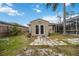 Large backyard storage shed with double doors and adjacent patio at 3506 Culpepper Ter, North Port, FL 34286