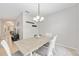 Dining room with table and chairs, view into living room at 3506 Culpepper Ter, North Port, FL 34286