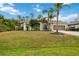 Single-story house with palm trees and a large grassy yard at 3506 Culpepper Ter, North Port, FL 34286