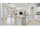 Kitchen features an island, granite countertops, and stainless steel appliances at 3506 Culpepper Ter, North Port, FL 34286