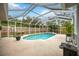 Inviting screened pool area with patio and lush landscaping at 3506 Culpepper Ter, North Port, FL 34286