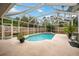 Inviting screened pool area with patio and lush landscaping at 3506 Culpepper Ter, North Port, FL 34286