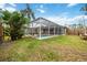 Screened-in swimming pool with lush landscaping at 3506 Culpepper Ter, North Port, FL 34286