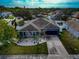 Blue house with a white rock garden in front at 363 64Th Avenue E Cir, Bradenton, FL 34203