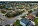 Wide aerial view of a residential neighborhood with various house styles and landscaping at 363 64Th Avenue E Cir, Bradenton, FL 34203