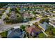 An aerial view of a residential neighborhood with houses, streets, and green spaces at 363 64Th Avenue E Cir, Bradenton, FL 34203