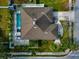 Top-down view of a house with a brown roof and a pool at 363 64Th Avenue E Cir, Bradenton, FL 34203