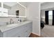 Modern bathroom with double vanity, marble countertop, and walk-in shower at 363 64Th Avenue E Cir, Bradenton, FL 34203