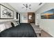 Main bedroom with king bed, large TV, and ceiling fan at 363 64Th Avenue E Cir, Bradenton, FL 34203