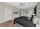 Main bedroom with king-size bed and window coverings at 363 64Th Avenue E Cir, Bradenton, FL 34203