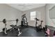 Home gym with exercise equipment including weights and a stationary bike at 363 64Th Avenue E Cir, Bradenton, FL 34203