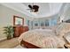 Bright bedroom with a king-size bed and lots of natural light at 3843 E 59 Avenue Cir, Ellenton, FL 34222