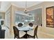 Breakfast nook with a view of the pool and lanai at 3843 E 59 Avenue Cir, Ellenton, FL 34222