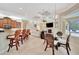 Bright breakfast nook with glass-top table and wicker chairs at 3843 E 59 Avenue Cir, Ellenton, FL 34222