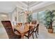 Elegant dining room with chandelier and hardwood floors, seating for six at 3843 E 59 Avenue Cir, Ellenton, FL 34222