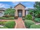 Inviting entryway with a stone accent and lush landscaping at 3843 E 59 Avenue Cir, Ellenton, FL 34222