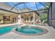 Private screened pool and spa with a tranquil fountain at 3843 E 59 Avenue Cir, Ellenton, FL 34222