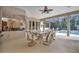 Spacious covered patio overlooking the pool and lush landscaping at 3843 E 59 Avenue Cir, Ellenton, FL 34222