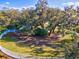 Fenced dog park with ample space under large oak trees at 3922 Wildgrass Pl, Parrish, FL 34219