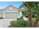 Front view of charming house with attached garage and landscaped yard at 3922 Wildgrass Pl, Parrish, FL 34219