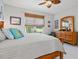 Main bedroom with wood furniture, light walls, and window coverings at 3922 Wildgrass Pl, Parrish, FL 34219