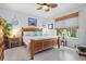 Spacious main bedroom with wood furniture and large window at 3922 Wildgrass Pl, Parrish, FL 34219