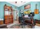 Home office or music room with wood desk and eclectic decor at 3922 Wildgrass Pl, Parrish, FL 34219