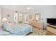 Spacious bedroom with dresser, TV, and plenty of closet space at 3987 Maceachen Blvd # 123, Sarasota, FL 34233