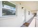 Bright hallway with white walls and doors to individual condo units at 3987 Maceachen Blvd # 123, Sarasota, FL 34233