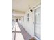 Well-lit hallway with access to condo units at 3987 Maceachen Blvd # 123, Sarasota, FL 34233