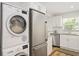 Stackable washer and dryer in a convenient laundry closet at 3987 Maceachen Blvd # 123, Sarasota, FL 34233