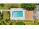 Overhead view of refreshing community pool with lounge chairs at 3987 Maceachen Blvd # 123, Sarasota, FL 34233