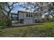 Two-story home with screened porch and lush landscaping at 4027 Siren Rd, Venice, FL 34293