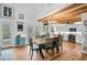 Modern kitchen with exposed beams, copper sink, and wooden floors at 4027 Siren Rd, Venice, FL 34293