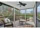 Relaxing screened porch with comfortable seating and water views at 4027 Siren Rd, Venice, FL 34293