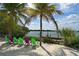 Beachfront property with colorful chairs and calm water views at 418 Sarabay Rd, Osprey, FL 34229