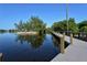 Scenic boardwalk path over water, offering tranquil views of lush foliage and calm waters at 418 Sarabay Rd, Osprey, FL 34229