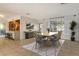 Bright dining room featuring a light wood table and six chairs at 418 Sarabay Rd, Osprey, FL 34229