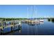 Boats docked at a wooden pier, showcasing the waterfront lifestyle at 418 Sarabay Rd, Osprey, FL 34229