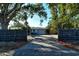 Ranch home with driveway and black fence at 418 Sarabay Rd, Osprey, FL 34229