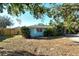 Light blue house with a well-maintained lawn at 418 Sarabay Rd, Osprey, FL 34229