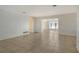 Open living room with tile floors and view into another room at 418 Sarabay Rd, Osprey, FL 34229