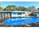 Refreshing kidney-shaped pool and wooden deck at 418 Sarabay Rd, Osprey, FL 34229