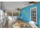 Relaxing screened porch with ceiling fans and blue walls at 418 Sarabay Rd, Osprey, FL 34229